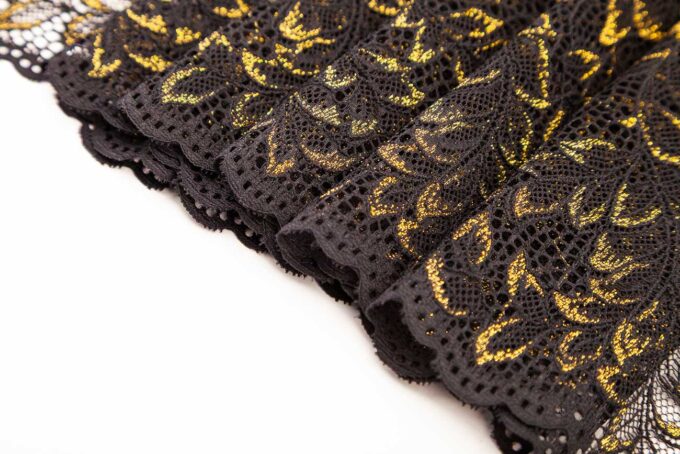 elastische schwarze Spitze mit glänzenden Lurexfäden in gold zum nähen von BHs, Slips, Panties, Strings etc.